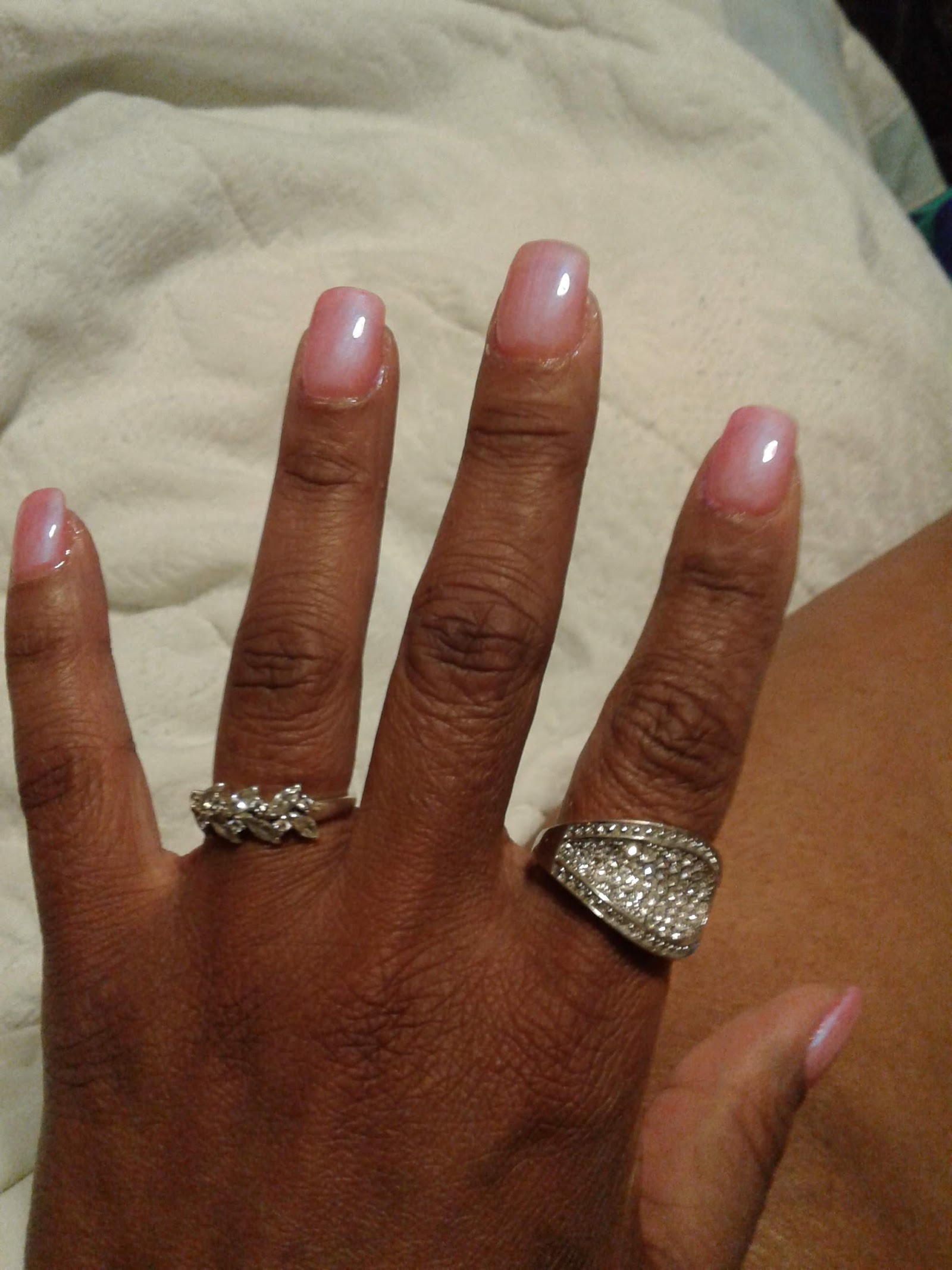 T J Nail logo